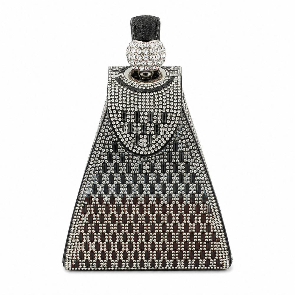 Decorative cowbell with rhinestone pattern on a white background